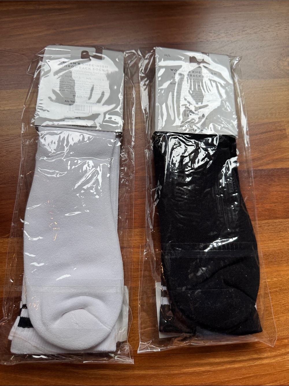 Pair of ALO Yoga Womens Athletic Knee-High Socks - White & Black - Picture 2 of 3